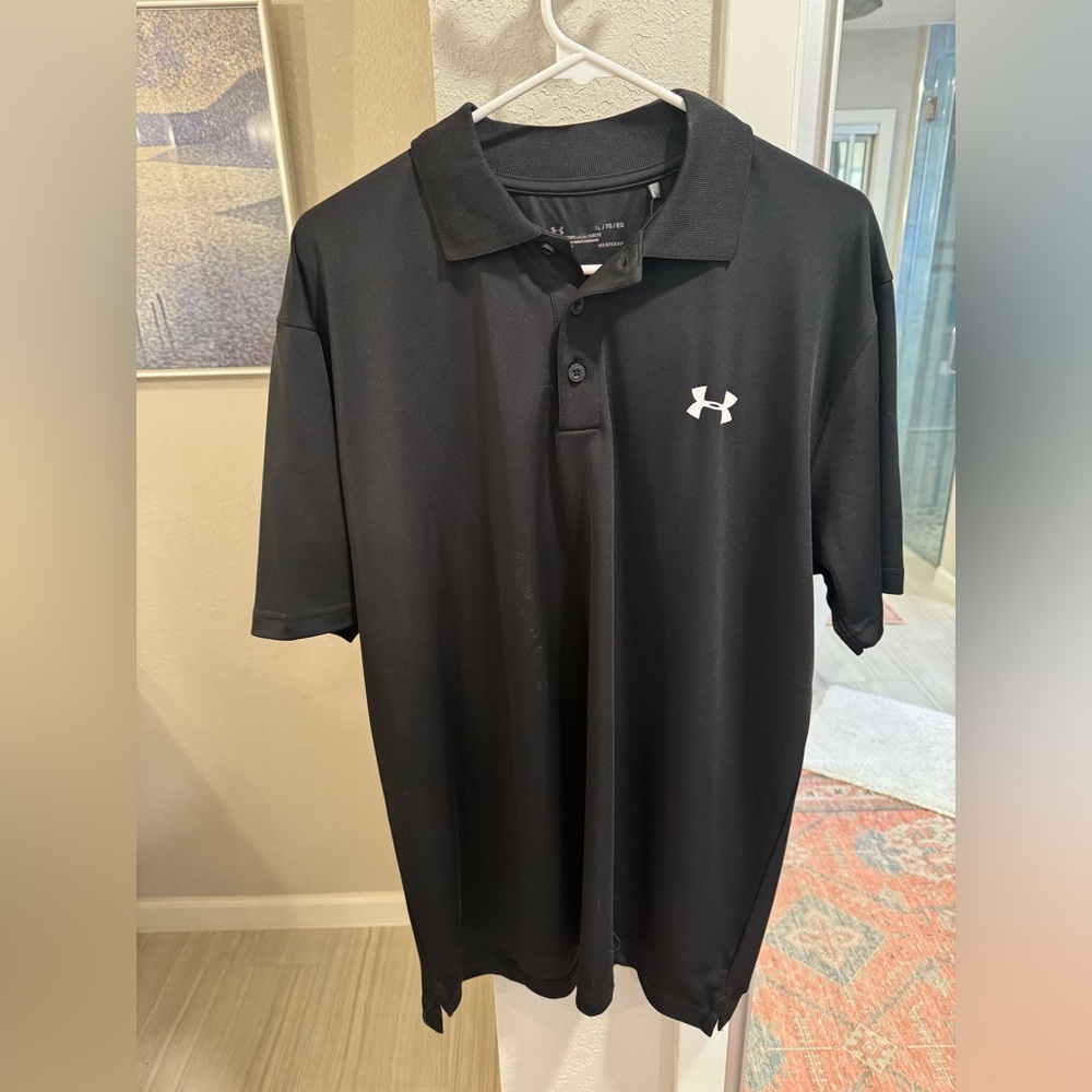 Extra large men’s black Under Armour polo. Tag still on.